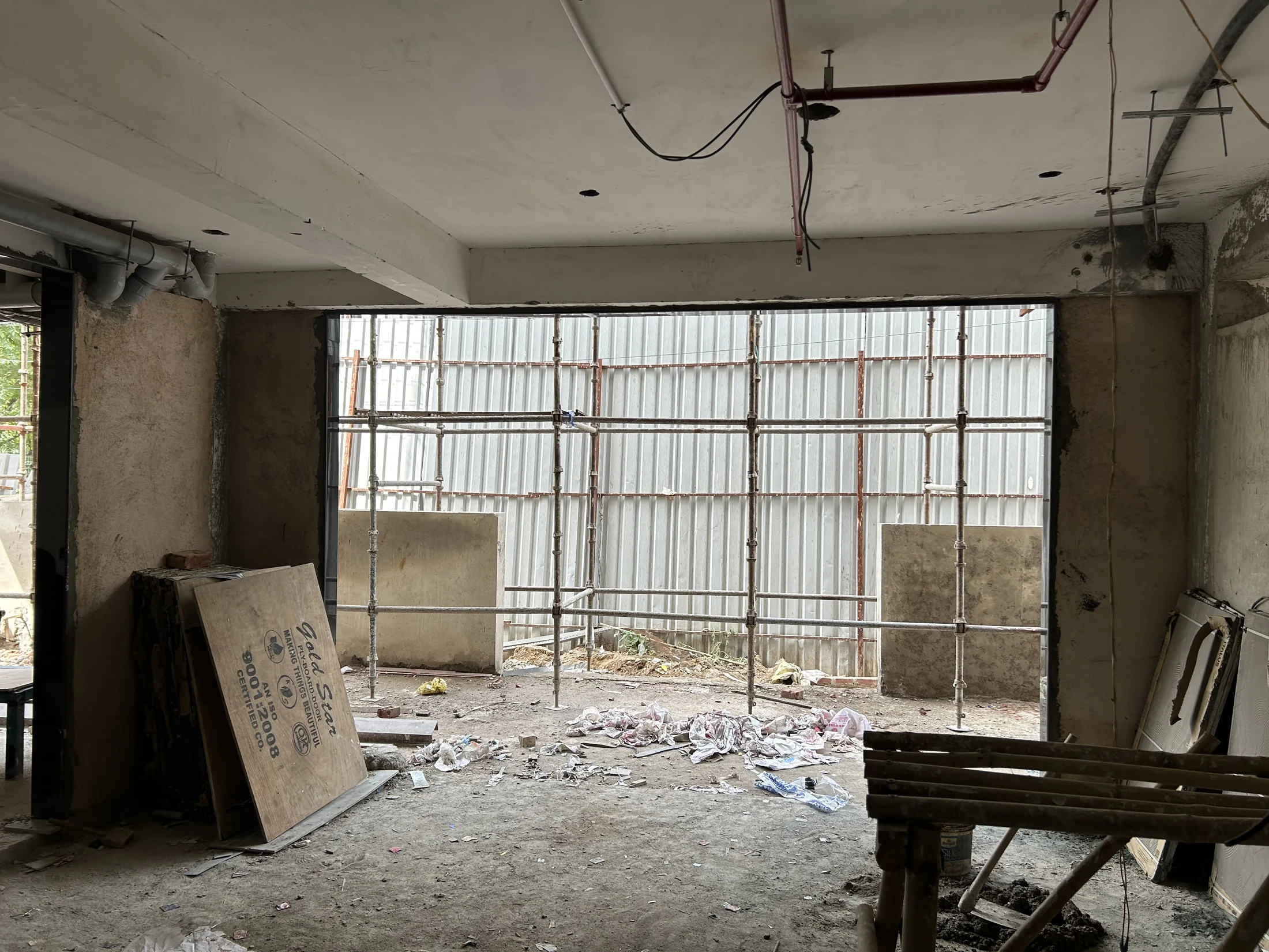Large opening under construction bringing light into the hotel interior