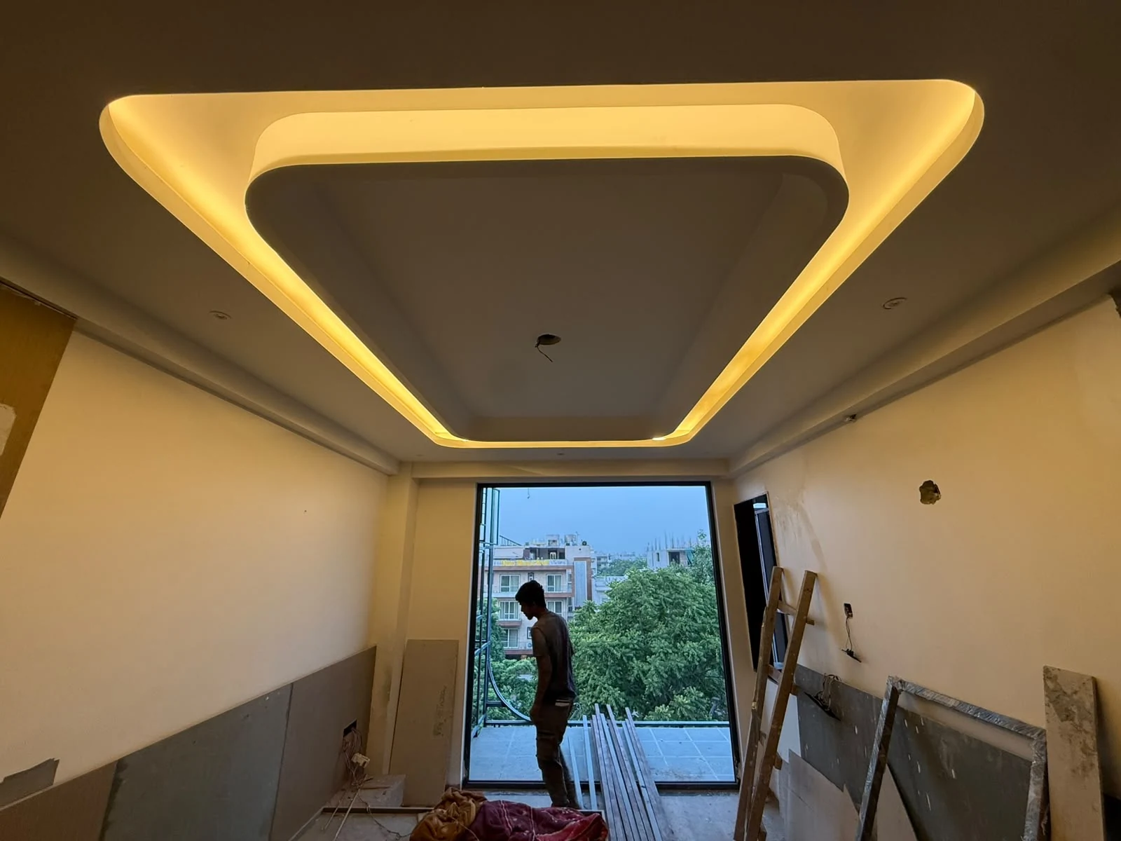 Illuminated ceiling feature in a hotel guest room under construction